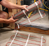 Make the turn by flipping the floor heating mat to the next row.